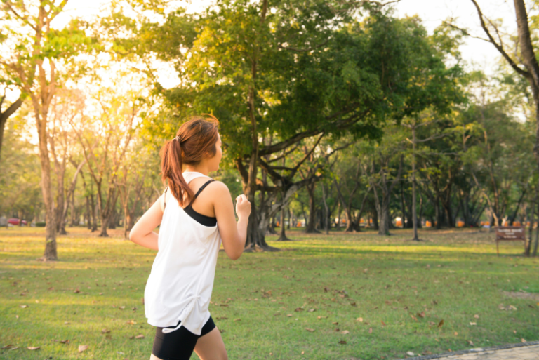 Lady running in park on a sunny day